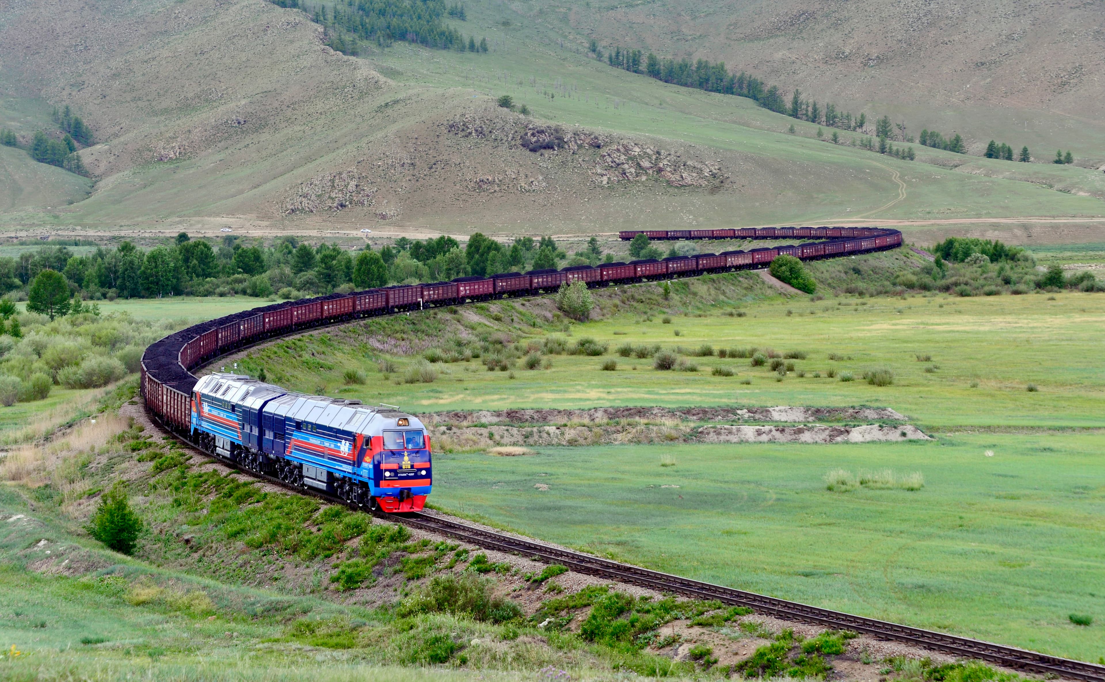 A passenger train on the railway in Mongolia.